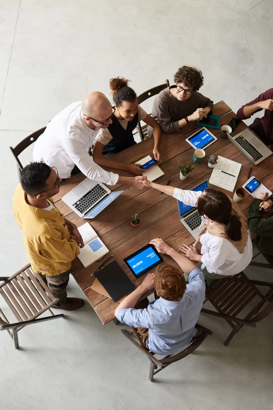 Team working together around a meeting table during a corporate shoot