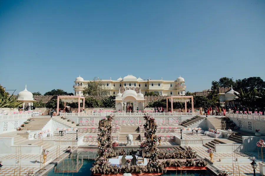 Wedding set up in the grounds of a heritage palace, chairs laid out before the ceremony
