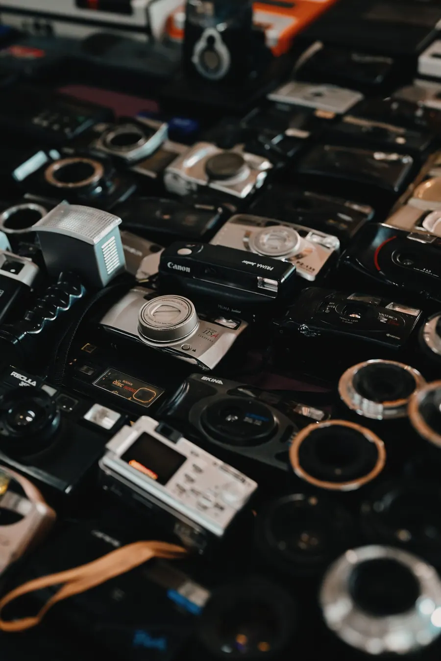 Camera bodies and lenses laid out before a shoot