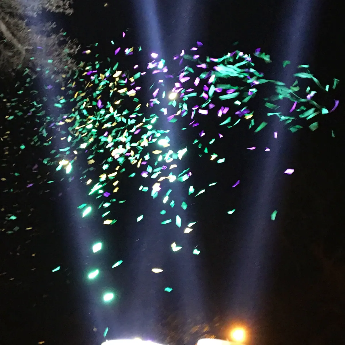Confetti falling across a stage at the close of an event