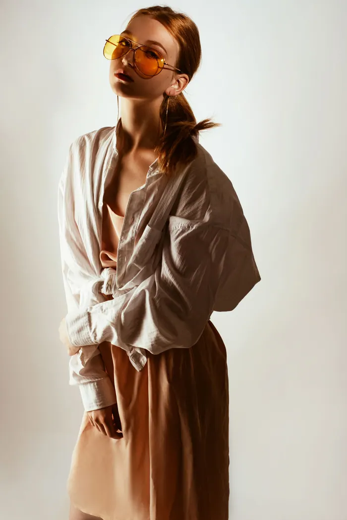 Full length portfolio frame shot against a plain studio backdrop