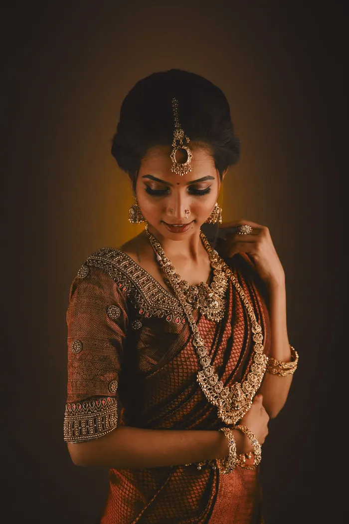 Expectant mother in traditional jewellery photographed in the studio