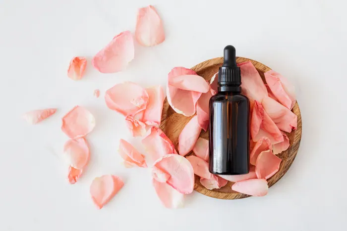 Bottled product styled with petals for a lifestyle frame
