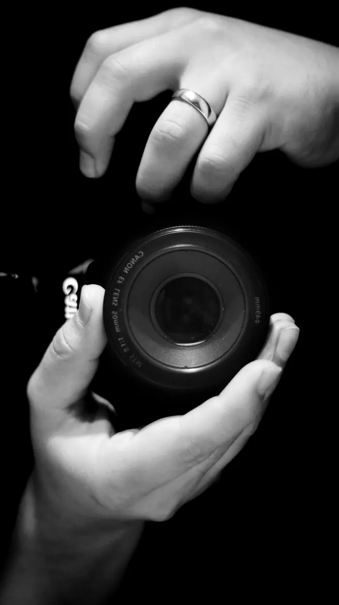Camera lens photographed as a product against black