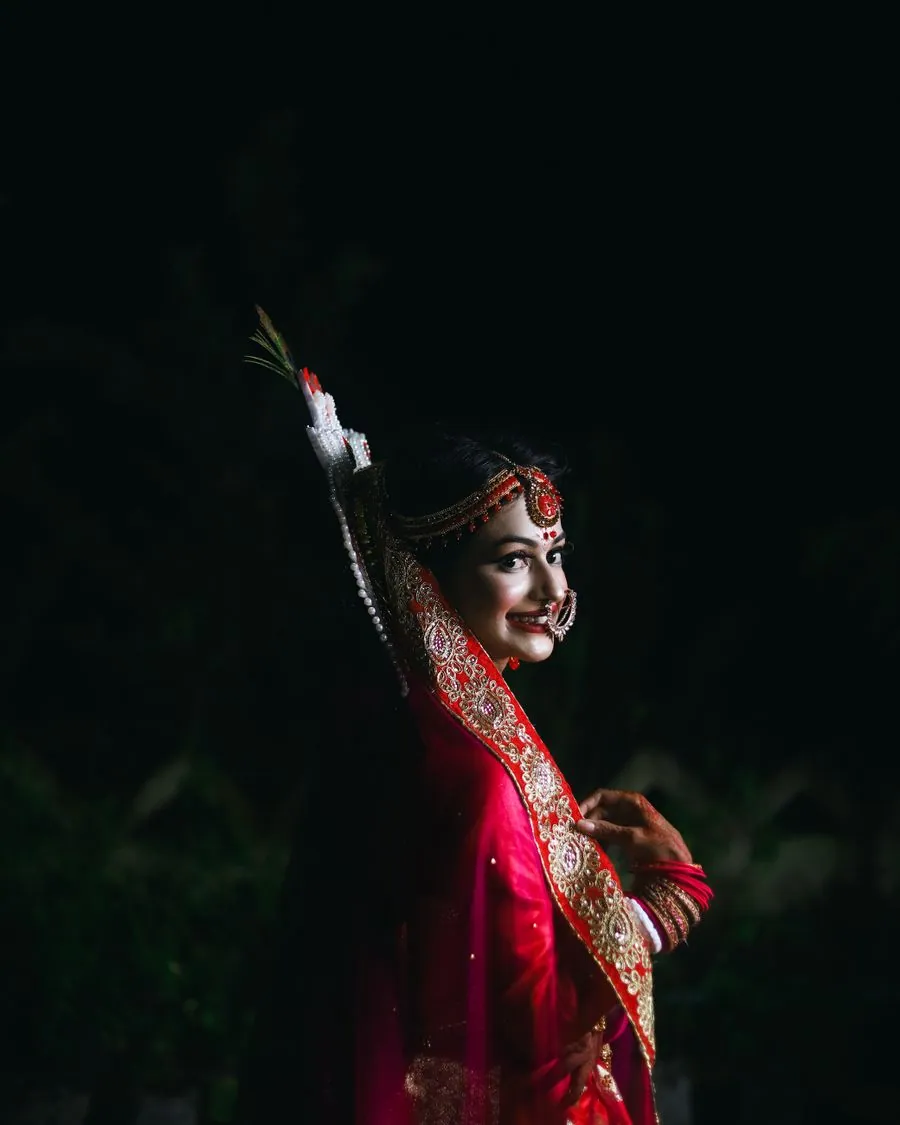 Bride photographed alone in low light before leaving her family home