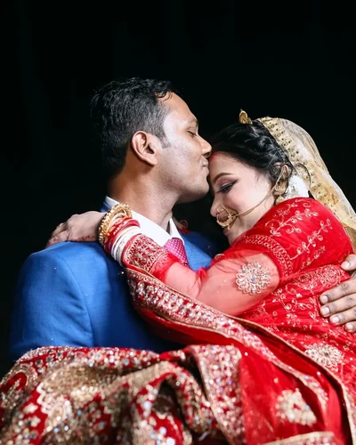 Bride and groom holding each other after the pheras