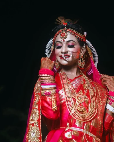 Bride looking away from the camera as the rituals continue around her
