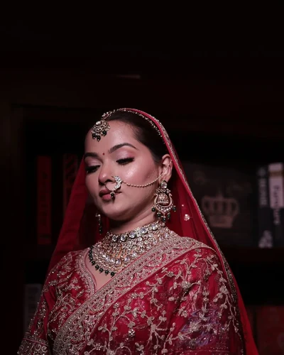 Bride photographed under warm light at the reception