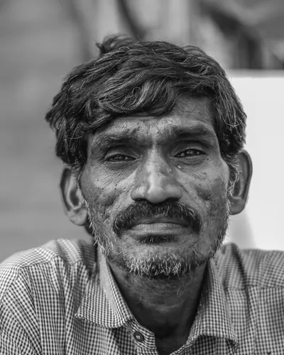 Black and white portrait of an older guest at the wedding